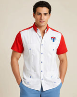 Man wearing a white shirt with red sleeves and a flag emblem on a beige background