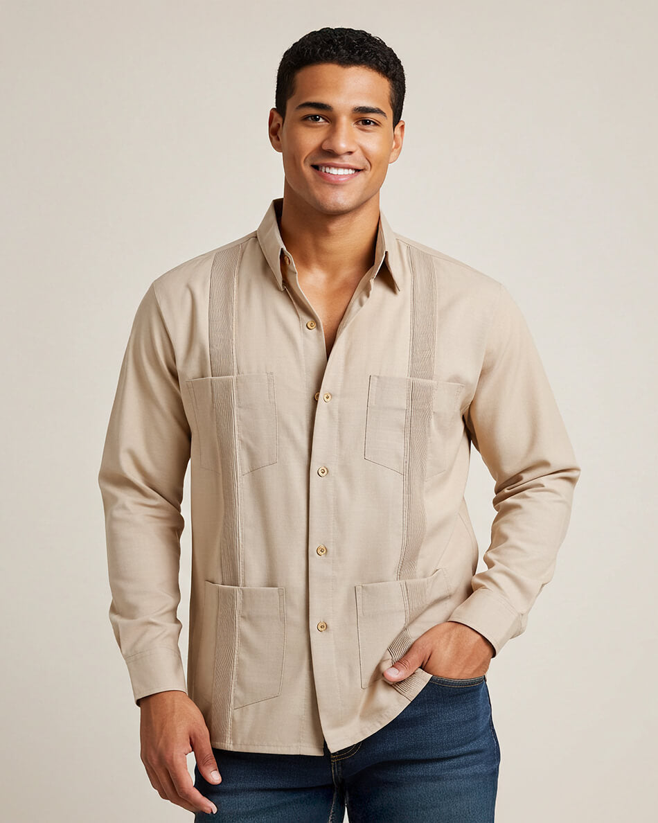 Man wearing a beige button-up guayabera shirt with a plain background
