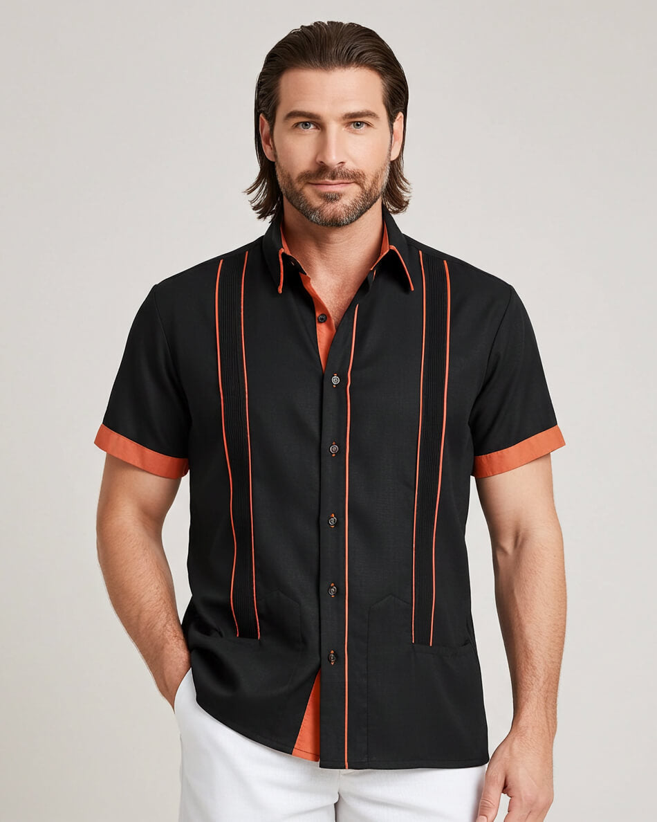Man wearing a black shirt with copper accents on a plain background
