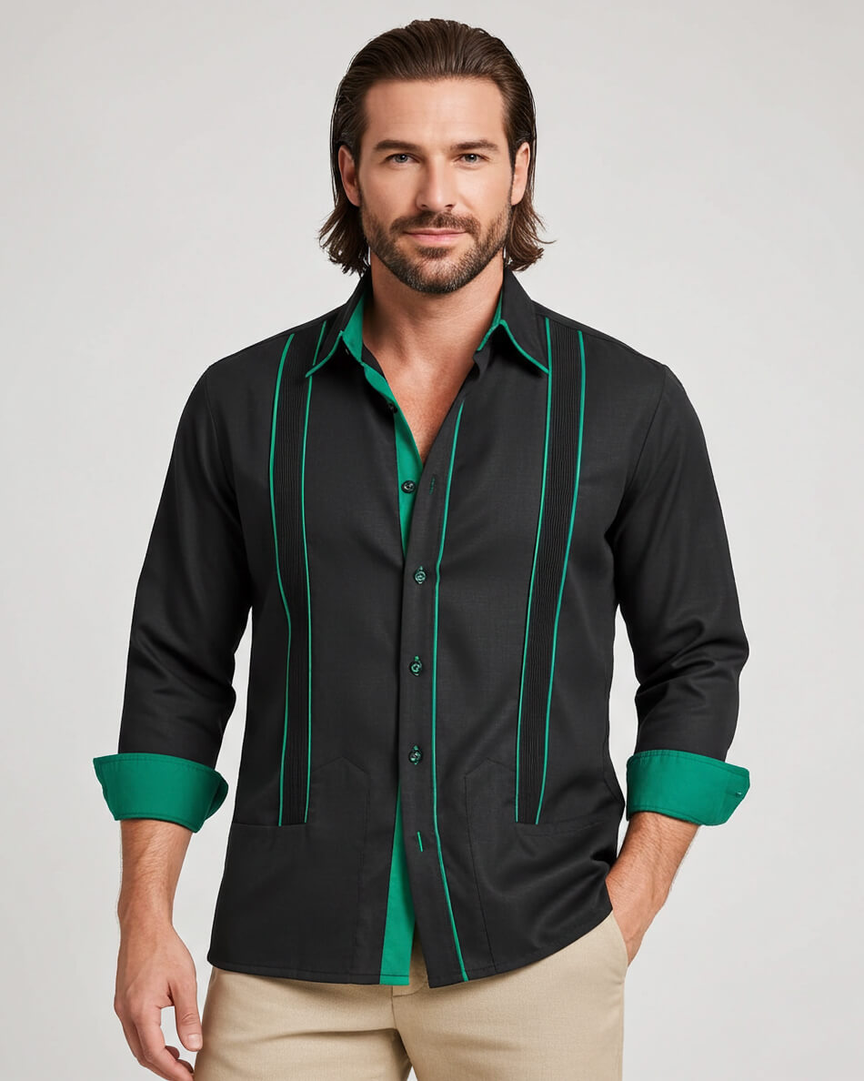 Man wearing a black guayabera shirt with green accents on a plain background