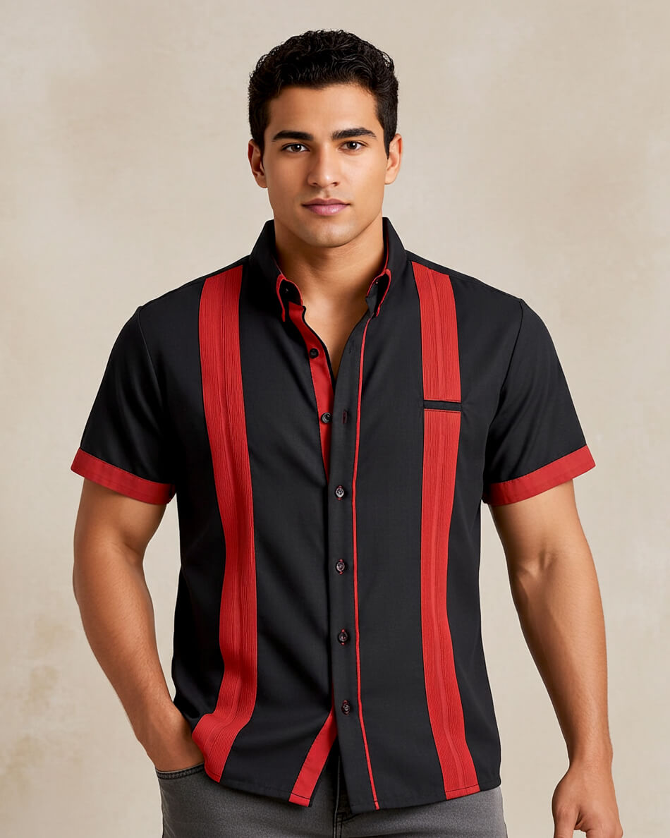 Man wearing a black presidencial guayabera shirt with red accents on a beige background