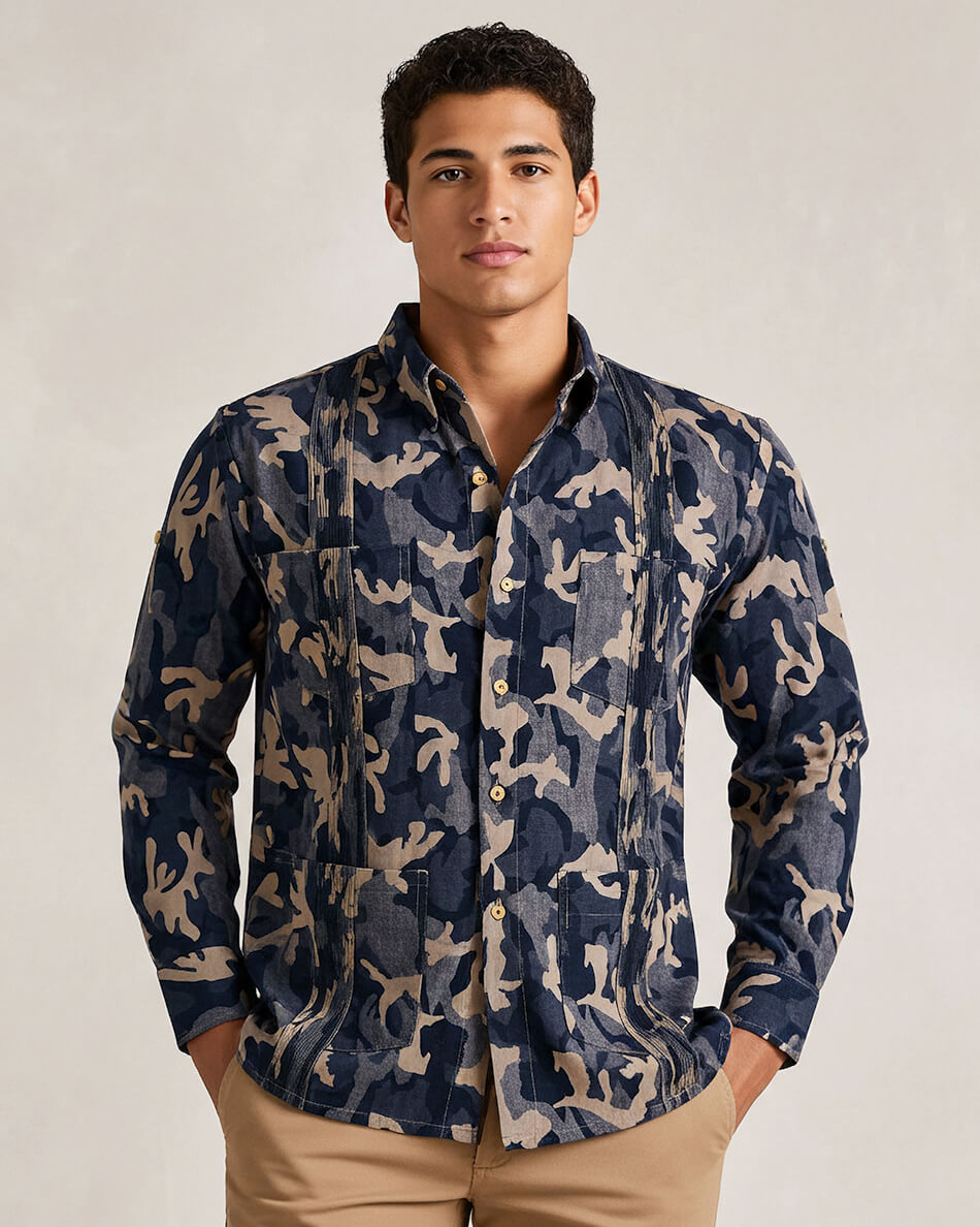 Man wearing a navy blue camouflage guayabera shirt against a plain background