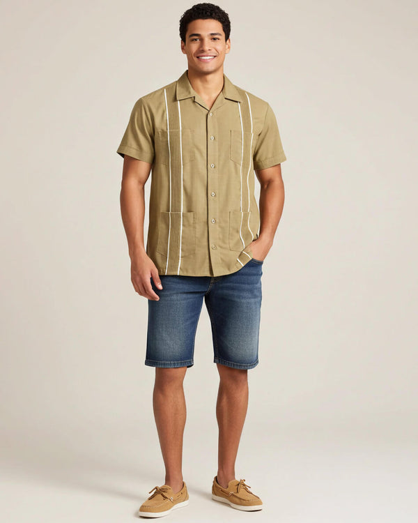 Man wearing a khaki guayabera button-up guayabera shirt with white stripes on a beige background