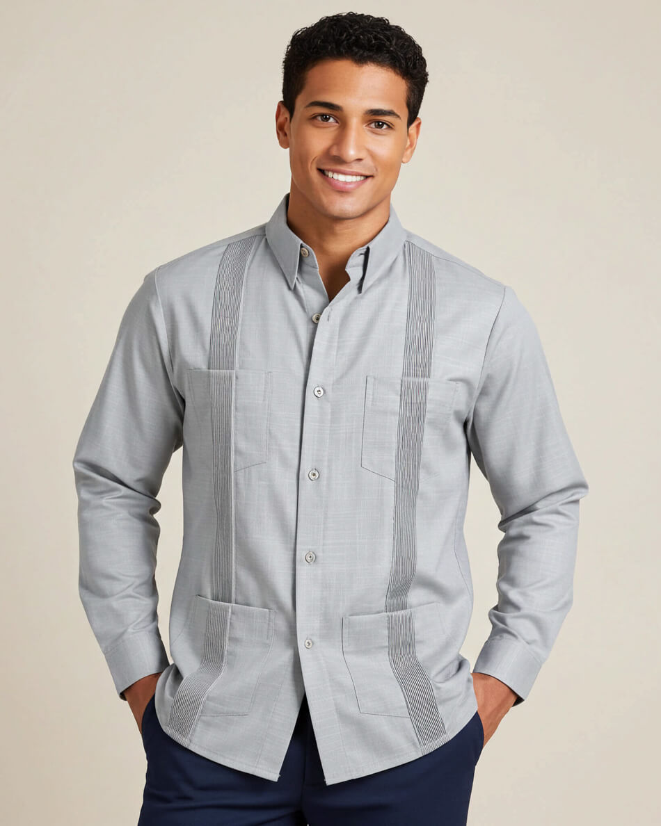 Man wearing a light gray guayabera shirt with vertical stripes on a beige background