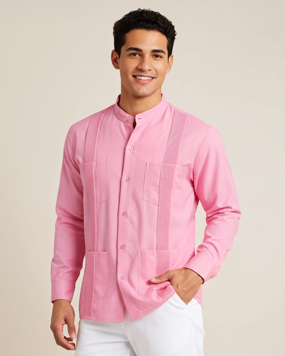Man wearing a pink guayabera shirt against a beige background