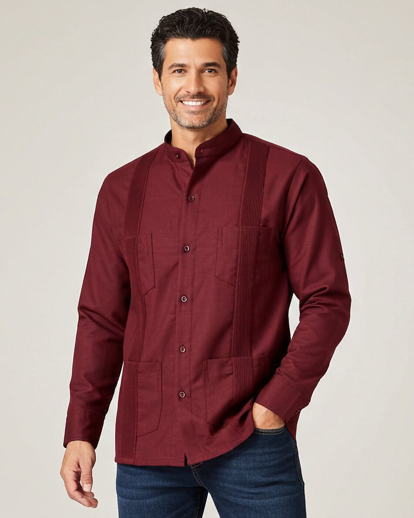 Man wearing a burgundy guayabera shirt with a plain background