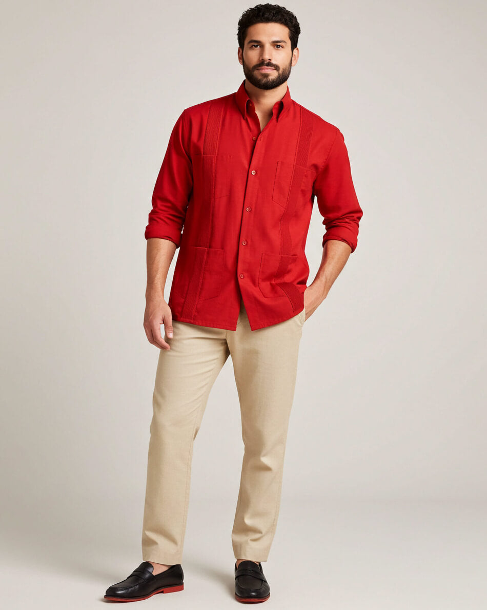 Man wearing a red long-sleeve shirt and beige pants on a plain background