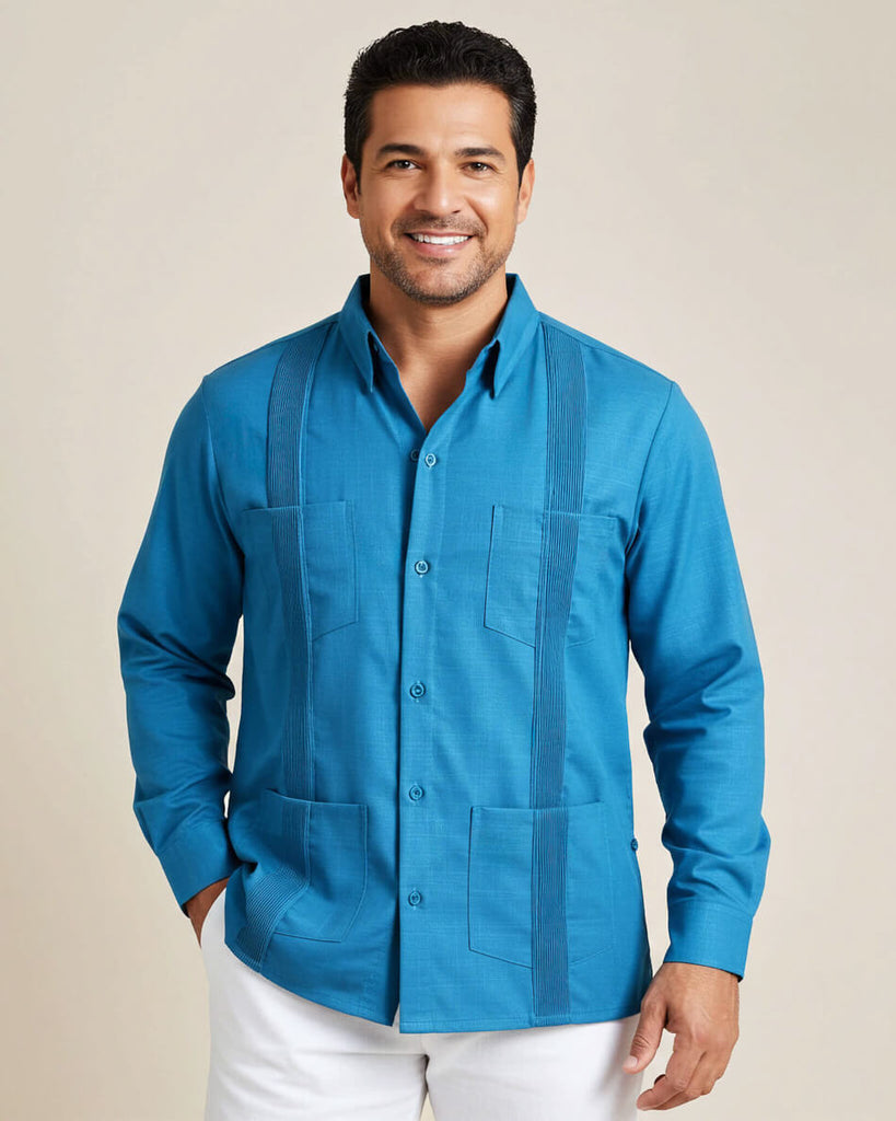Man wearing a turquoise blue button-up guayabera shirt with a beige background