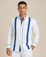 Man wearing a white guayabera shirt with blue stripes on a beige background