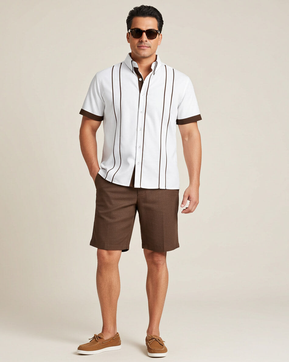 Man wearing a white guayabera shirt with brown accents and brown shorts on a beige background