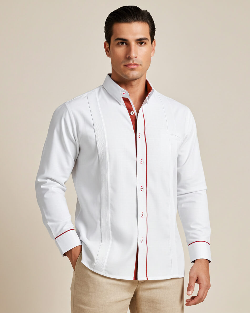 Man wearing a white guayabera shirt with copper accents on a beige background