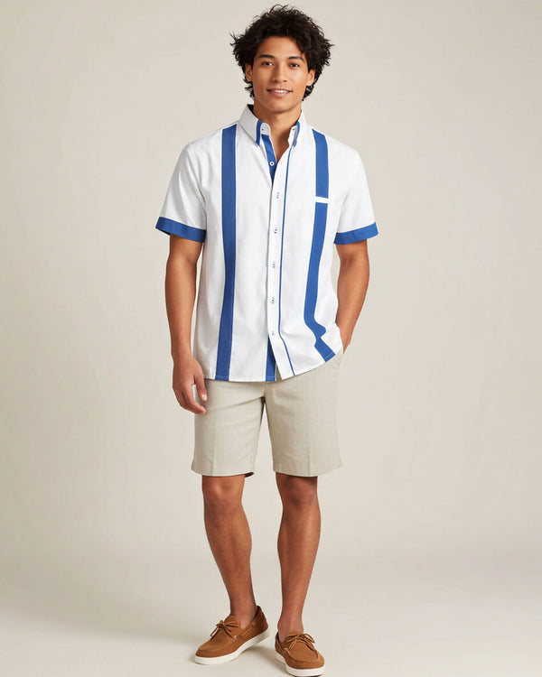 Man wearing a white guayabera shirt with plum blue stripes and beige shorts on a plain background