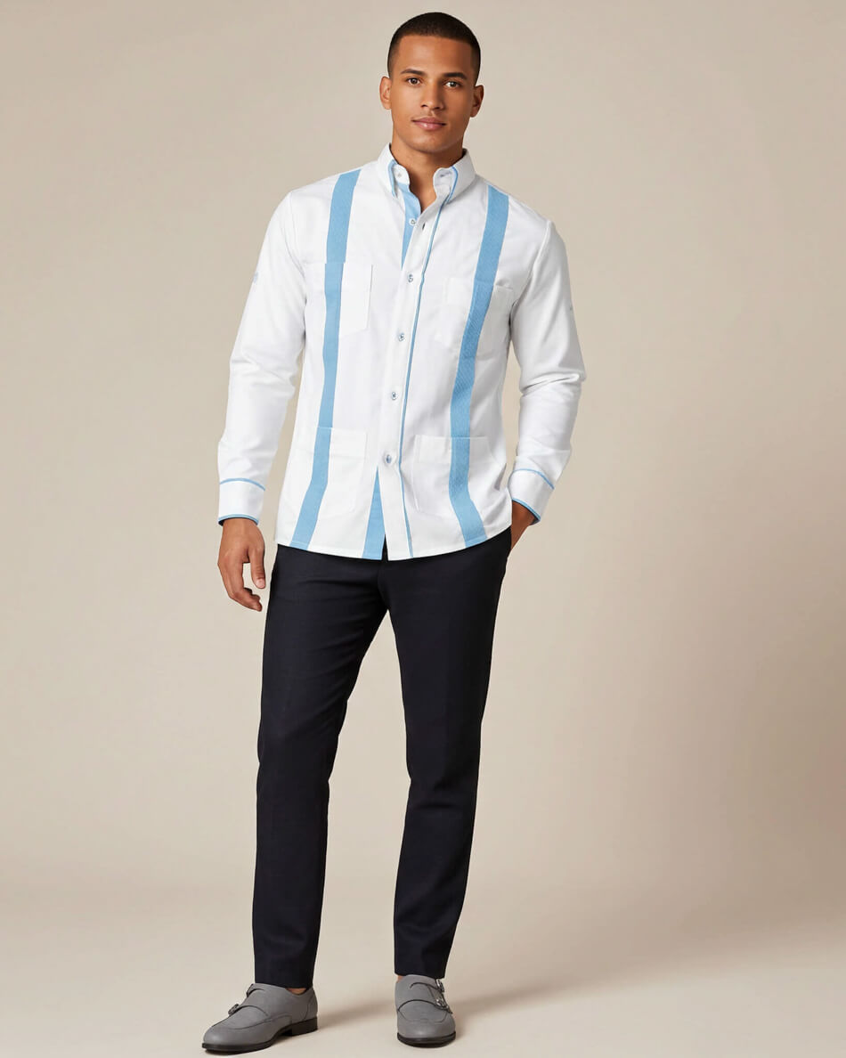 Man wearing a white guayabera shirt with blue stripes and dark pants on a beige background