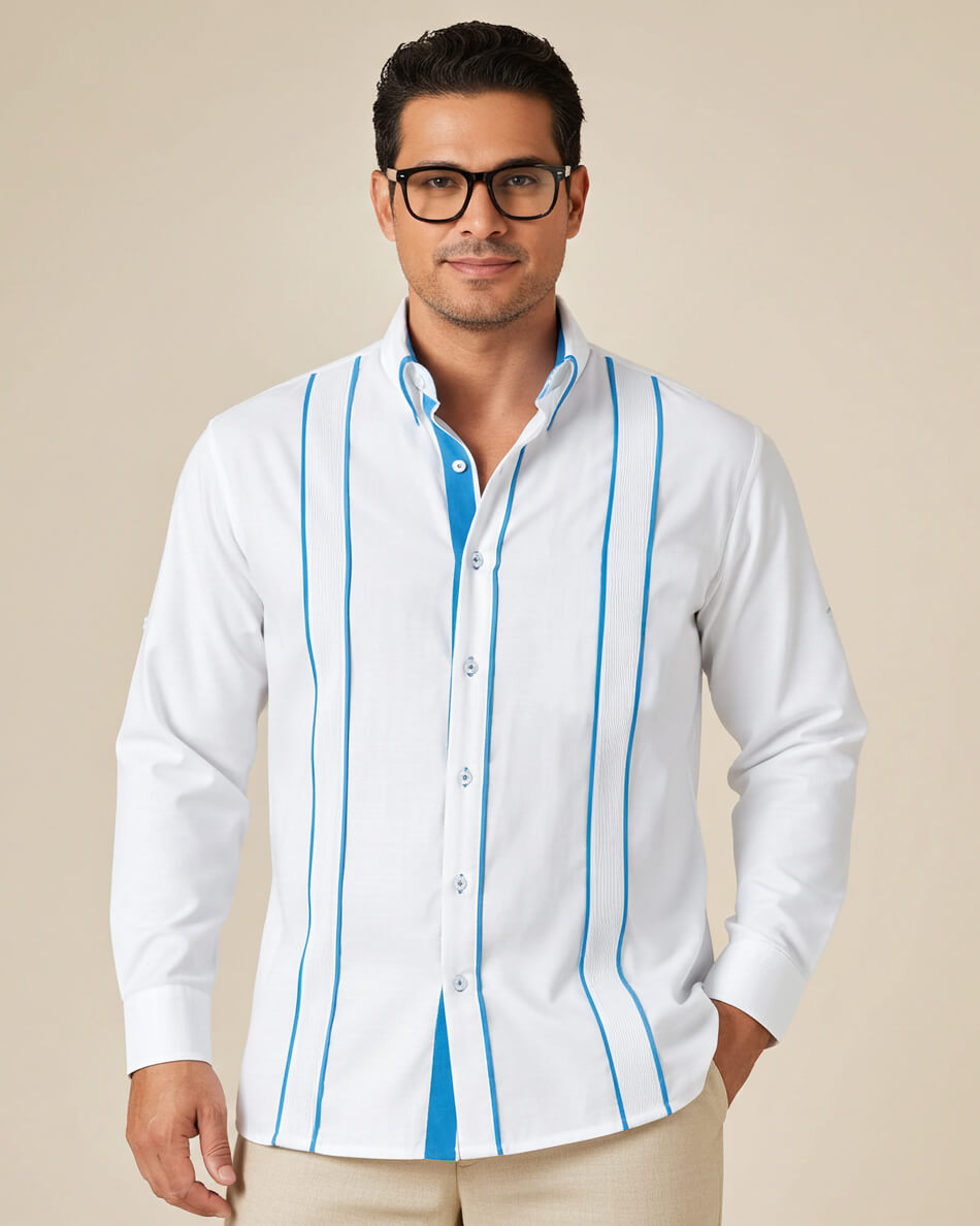 Man wearing a white guayabera shirt with turquoise stripes on a beige background