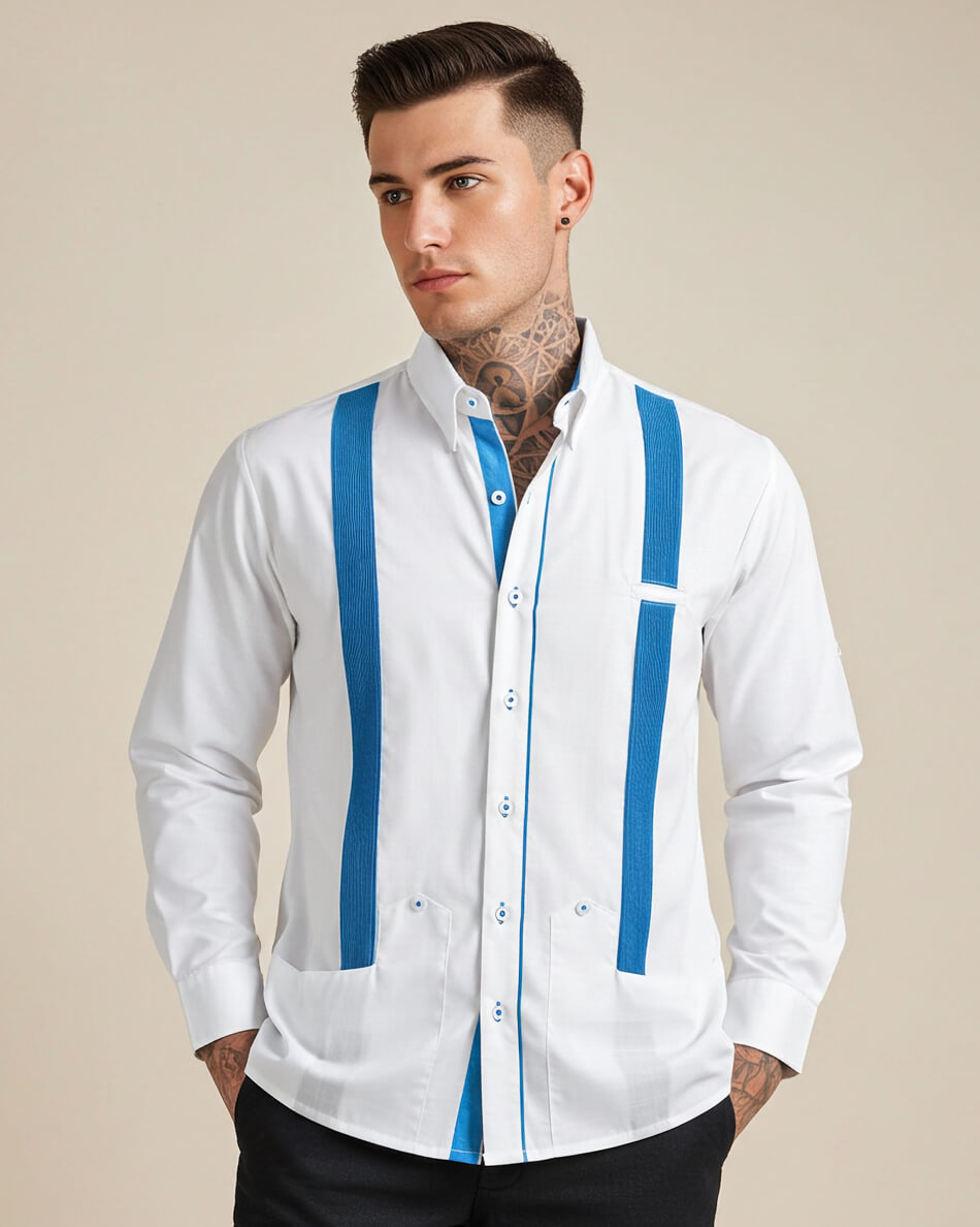 Man wearing a white guayabera shirt with turquoise stripes on a beige background