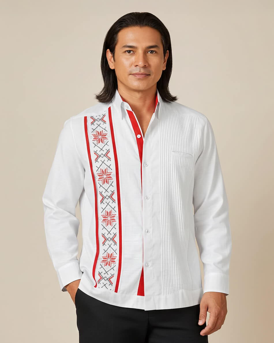 Man wearing a white and red guayabera embroidered shirt with red accents on a beige background